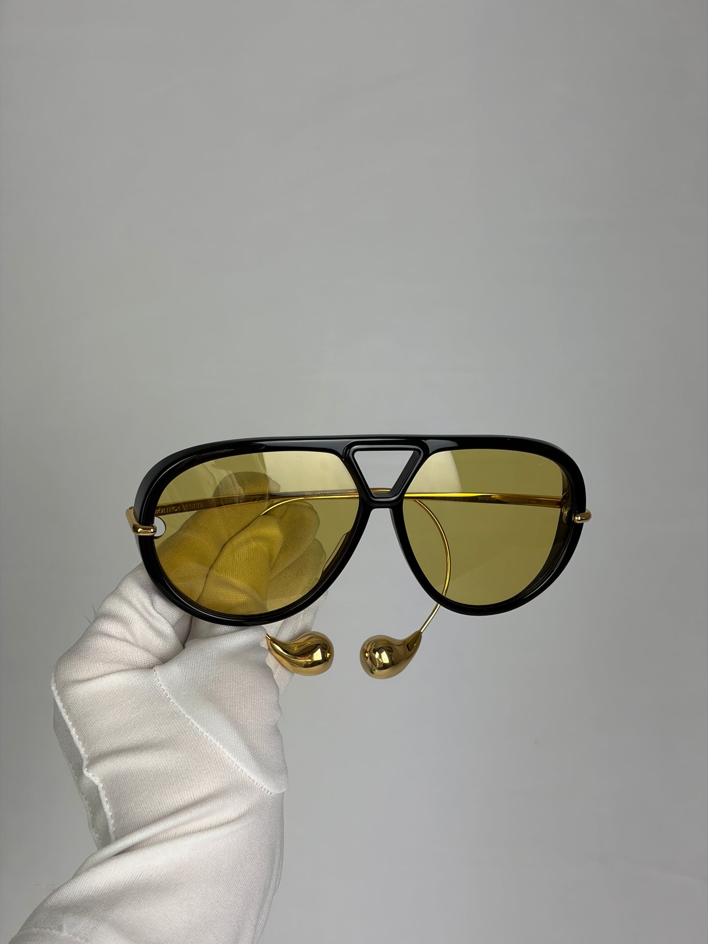 Bottega Veneta Aviator Sunglasses in Black and Gold with Yellow Lenses