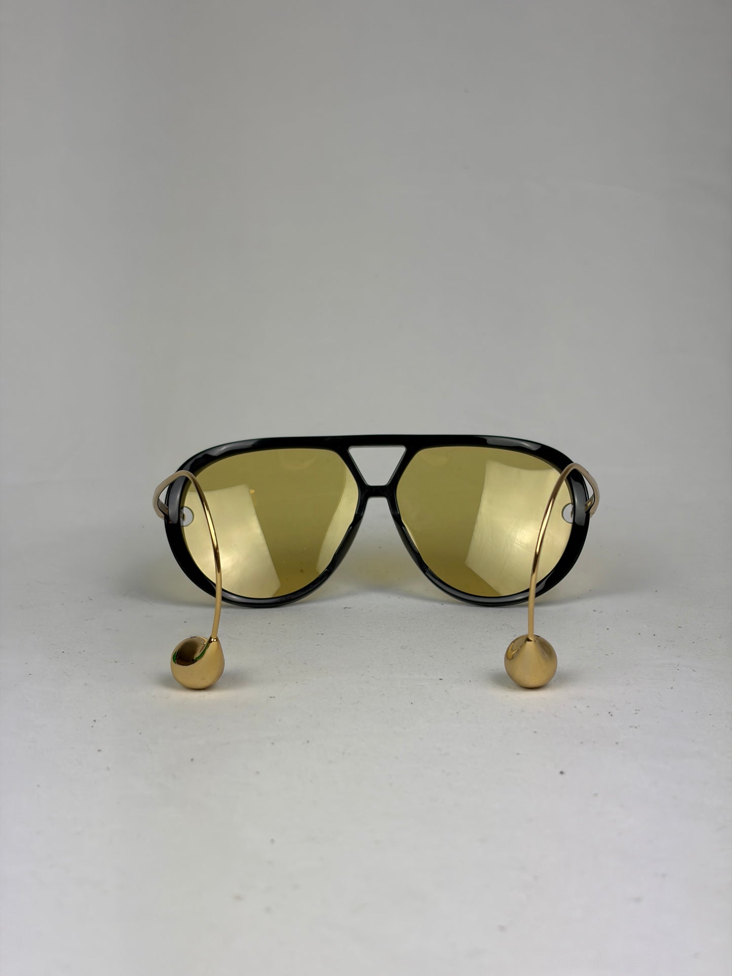 Bottega Veneta Aviator Sunglasses in Black and Gold with Yellow Lenses