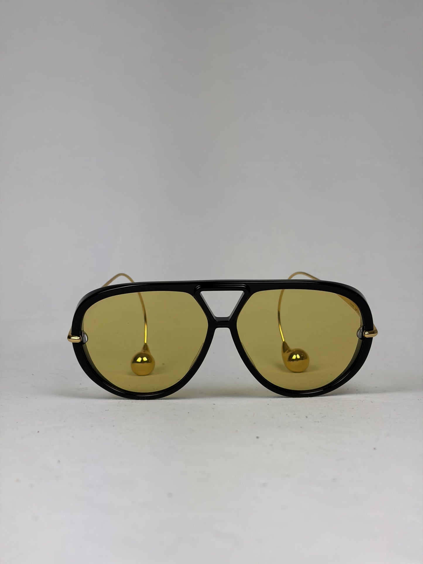 Bottega Veneta Aviator Sunglasses in Black and Gold with Yellow Lenses