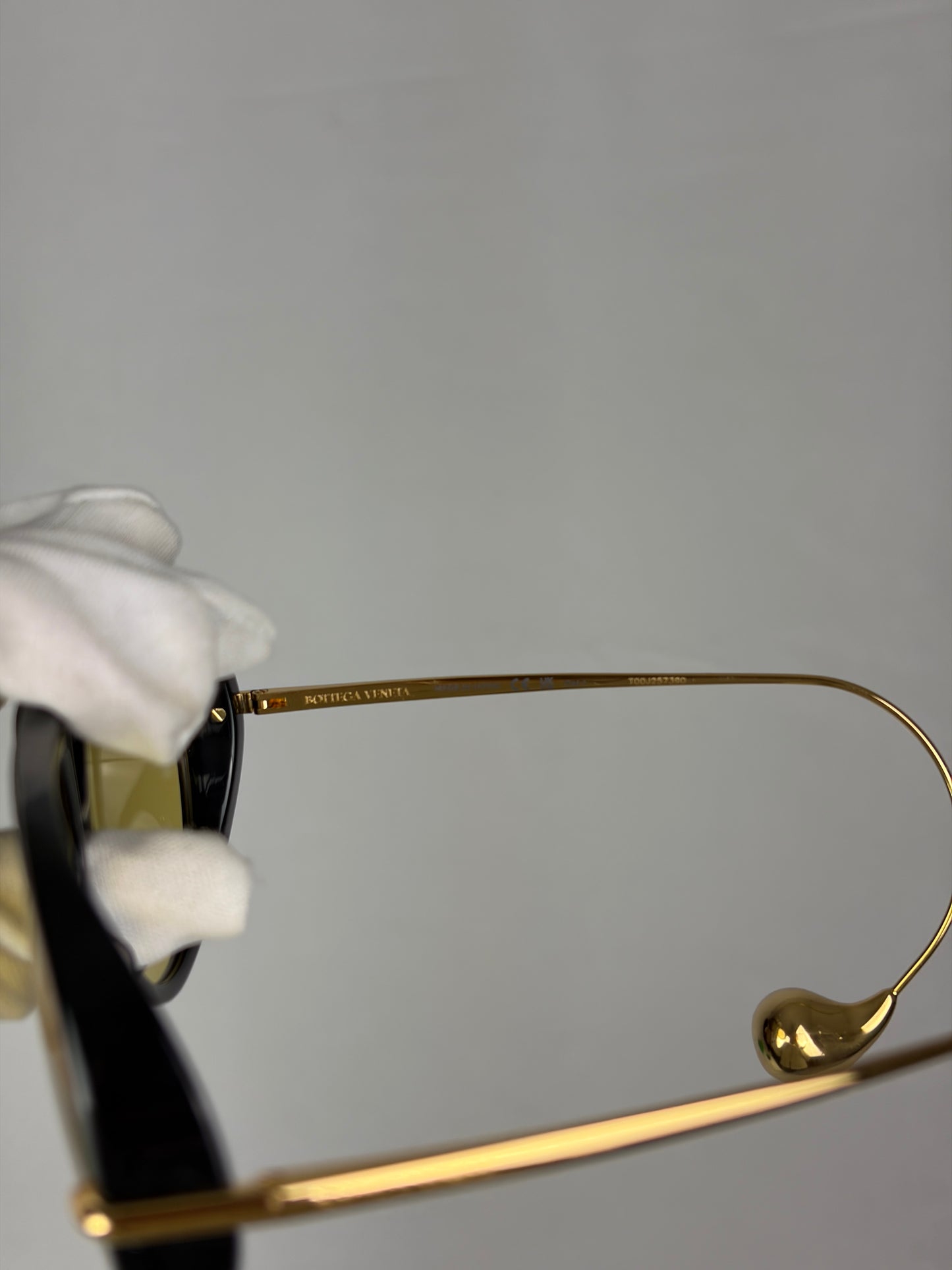 Bottega Veneta Aviator Sunglasses in Black and Gold with Yellow Lenses