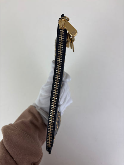 Christian Dior studded charm pouch